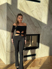 Stylish Black Off-Shoulder Cut-Out Jumpsuit with Sheer Sleeves – Bold and Fashion-Forward Outfit