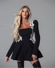 Elegant Black Flared Mini Dress with White Floral Embroidery – Perfect for Glamorous Occasions